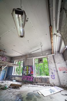 Ceiling lamp in a abandoned factory room