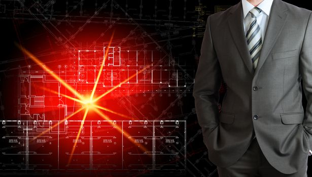 Businessman in a suit with background of glowing architectural drawing