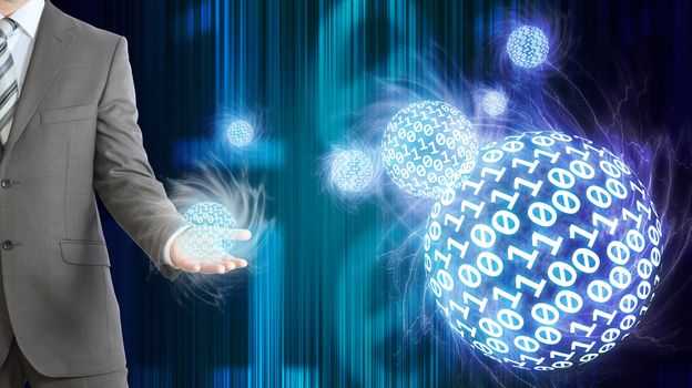 Businessman in a suit hold spheres of glowing digits. Dark background