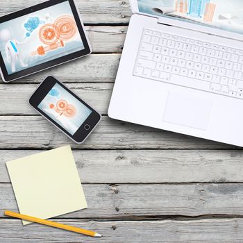 Laptop, tablet pc and smartphone on old wooden boards. Computer technology concept