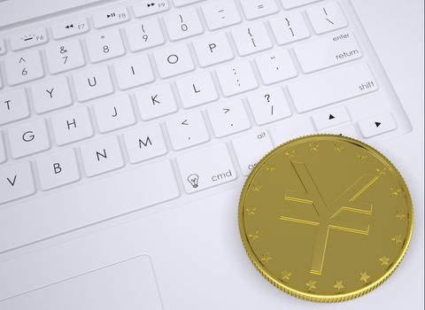 Gold yen coin on the keyboard. View from above