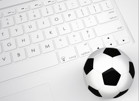 Soccer ball on the keyboard. View from above