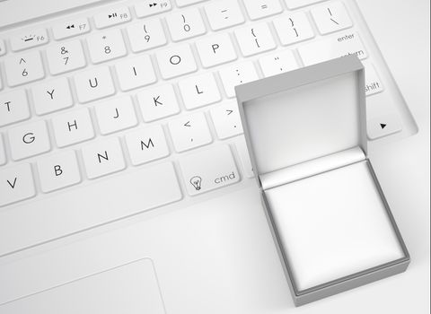 Box for jewelry on the keyboard. View from above