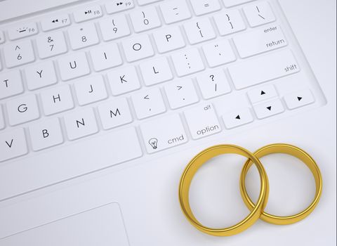 Two gold rings on the keyboard. View from above