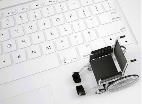 Wheelchair on the keyboard. View from above