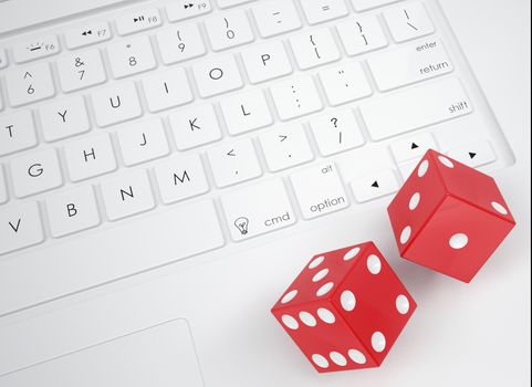 Red dice on the keyboard. View from above