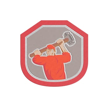 Metallic styled illustration of a union worker striking using smashhammer hammer done in retro style set inside shield crest on isolated white background.