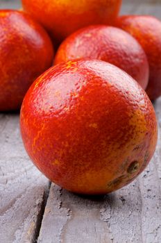 Heap of Blood Oranges Full Body closeup on Wooden background