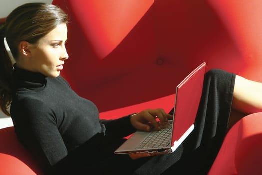 Portrait of an attractive young woman using laptop