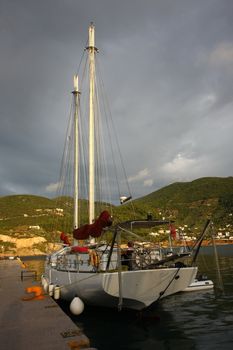 Sailboat in Skopelos town marina on Greek island Skopelos, after the storm