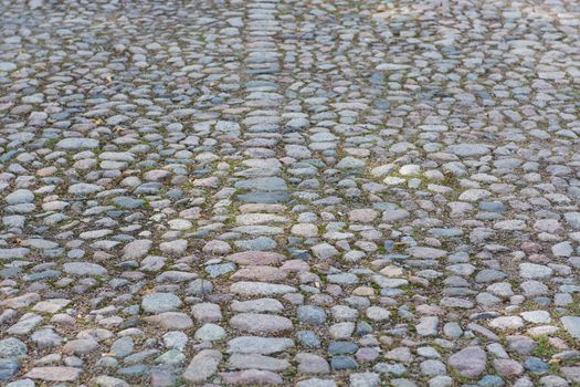 Background of an old cobble stone pavement with line pattern