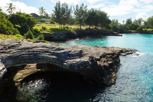 Beautiful arch like rock formations on the coast of Bermuda with a cave formed underneath.