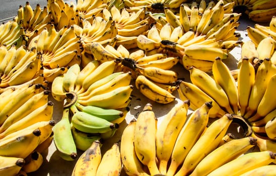 Group of banana is in the market ready to be taken home.