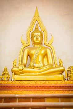 the golden budha sitting in the temple