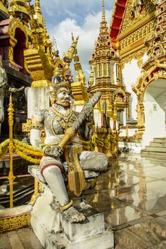 The giant protector in the Thai temple was built from money donated by the people in the villiange