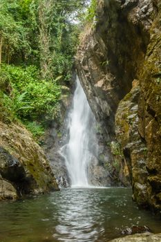 height waterfall in the middle of the forest