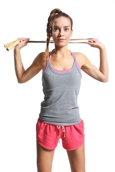 shapely woman exercising with a jump rope