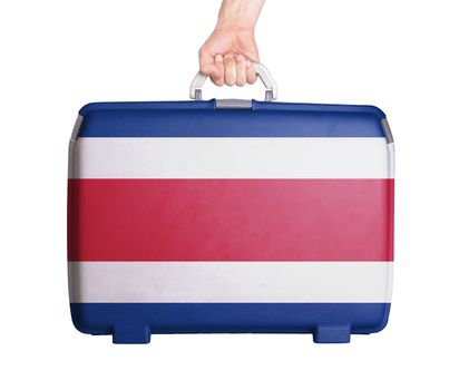 Used plastic suitcase with stains and scratches, printed with flag, Costa Rica