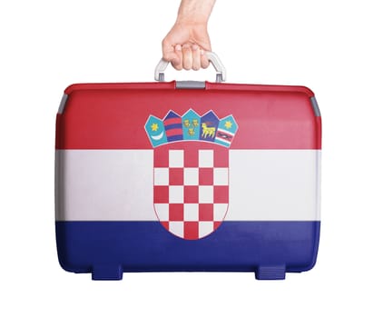 Used plastic suitcase with stains and scratches, printed with flag, Croatia