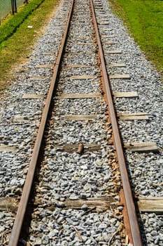 The small metal rail track constructed to suit a small train in the fun park