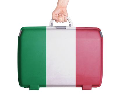 Used plastic suitcase with stains and scratches, printed with flag, Italy