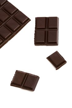 Tasty dark chocolate on a white background