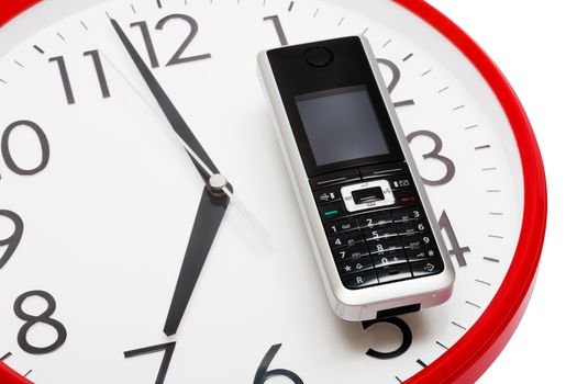 Modern phone on a dial of clock
