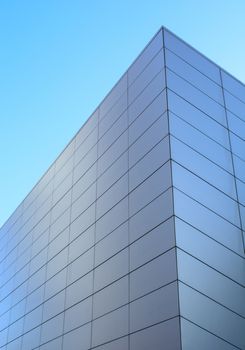 The beautiful corner of the building under the clear blue sky.