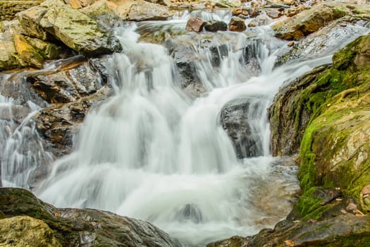 the beautiful white waterfall in the deep of big forest