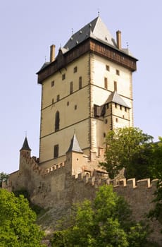 Karlstejn Castle - Big Tower. Karlstejn Castle - is a famous Gothic castle founded 1348 by Charles IV - King of Bohemia. The castle served as a place for safekeeping the Imperial Regalia as well as the Bohemian coronation jewels, holy relics and other royal treasures. Located about 30 km southwest of Prague above the village named Karlstejn, it is one of the most famous and most frequently visited castles in the Czech Republic. The castle was founded in 1348 by Charles IV.