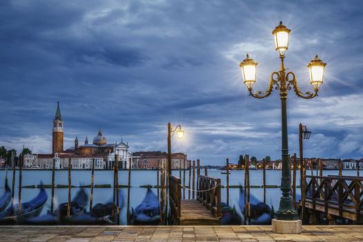 Gondolas floating in the Grand Canal after sunset