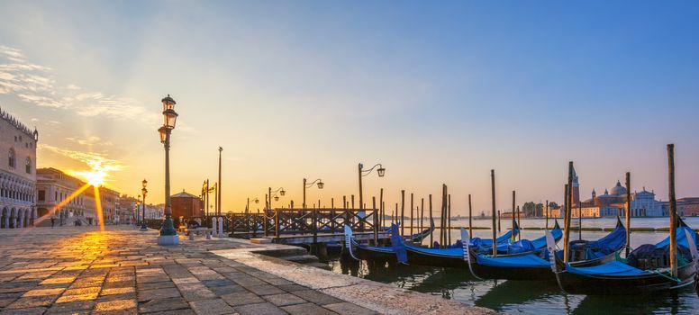 Panoramic view of Venice with gondolas at sunrise