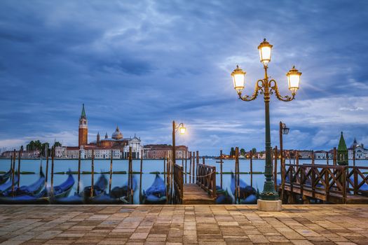 Gondolas floating in the Grand Canal after sunset