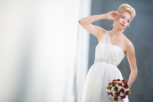 Gorgeous bride on her wedding day (color toned image; shallow DOF)