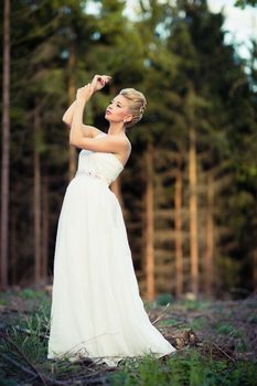 Lovely bride outdoors in a forest