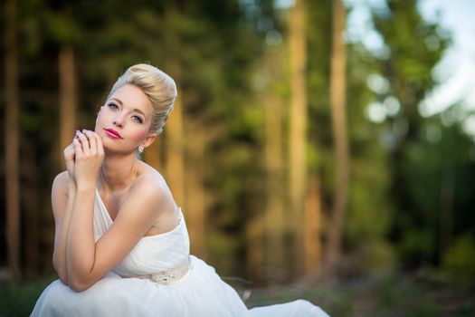 Lovely bride outdoors in a forest