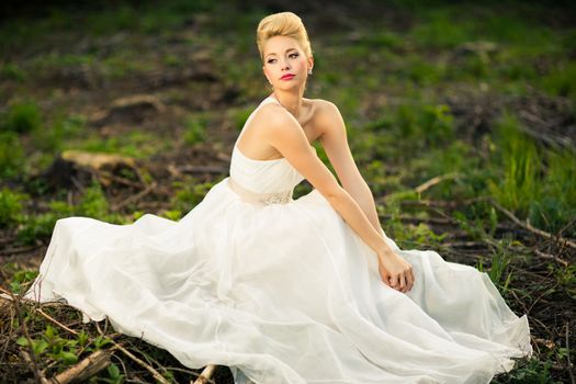 Lovely bride outdoors in a forest