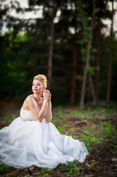 Lovely bride outdoors in a forest