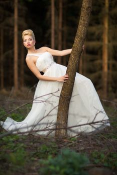 Lovely bride outdoors in a forest