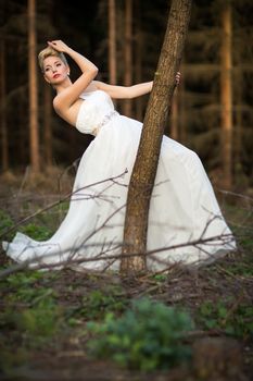 Lovely bride outdoors in a forest