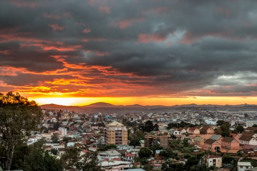 The glowing golden sun setting over Antananarivo,  the capital city of Madagascar