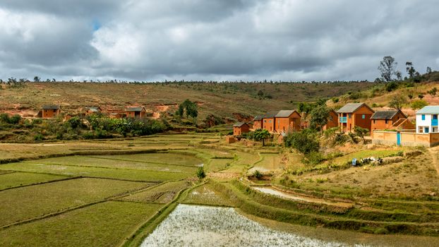 Malagasy homes build along the hills of  the central highlands of Madagascar