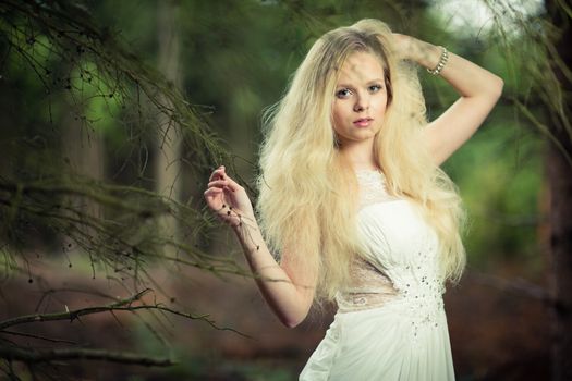 Lovely bride outdoors in a forest