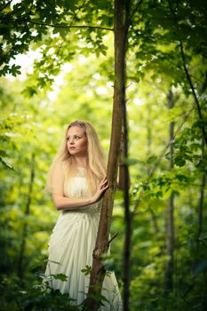 Lovely bride outdoors in a forest