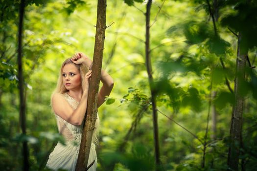 Lovely bride outdoors in a forest