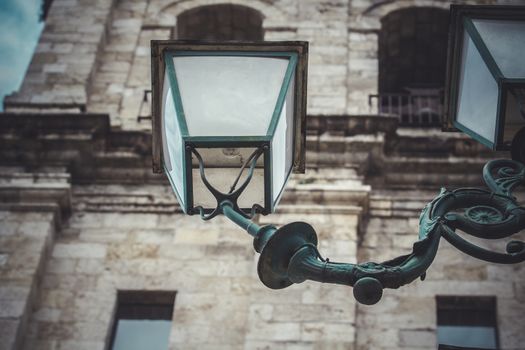 exterior, traditional street lamp with decorative metal flourishes