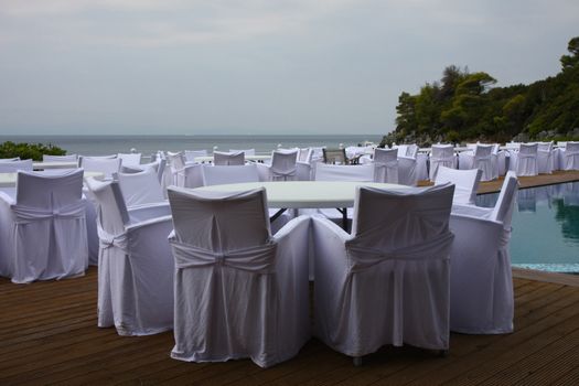 Decoration of wedding chairs and tables at the seaside