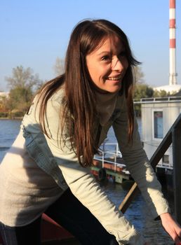 Portrait of young lady laughing and enjoying by the river