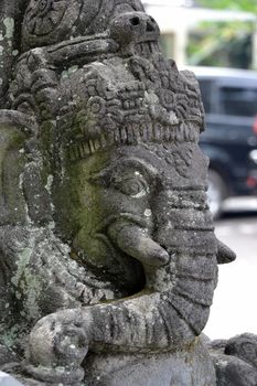 statue of ancient figure that made from solid rock