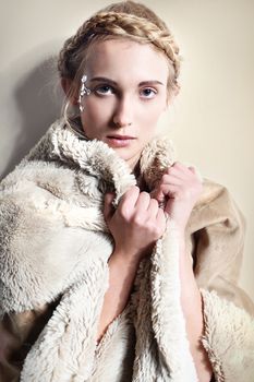 Natural woman in a fur coat